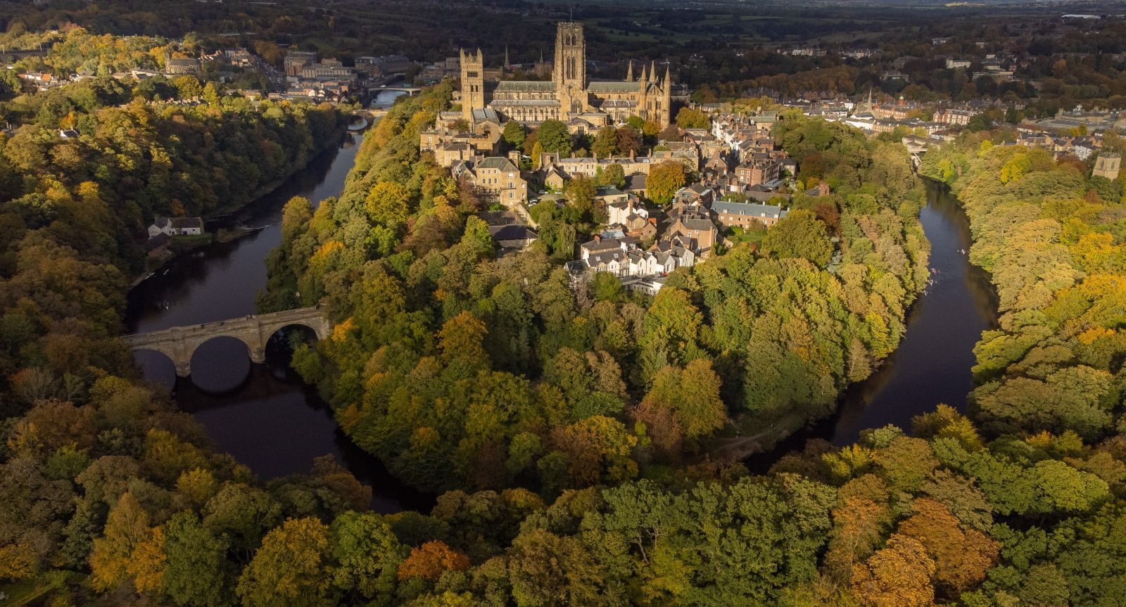An aerial shot of Durham City showing the River Wear wrapping round the historic city centre.